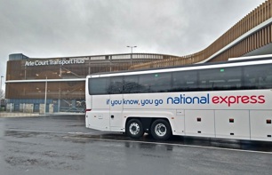 A National Express coach in front of Arle Court Transport Hub building